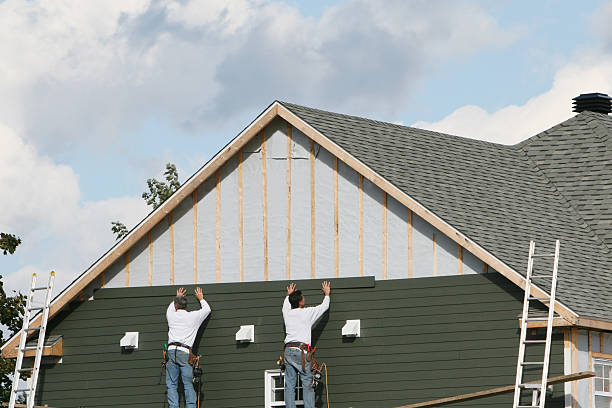 Professional Emergency Siding Repair technician working in Bloomington, TX